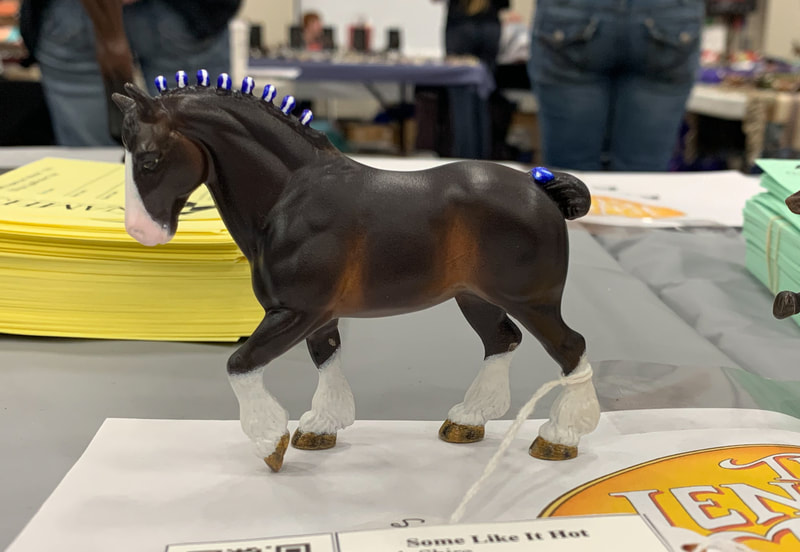 A tiny replica of the old Breyer Clydesdale Stallion at The Jennifer Show 2019.