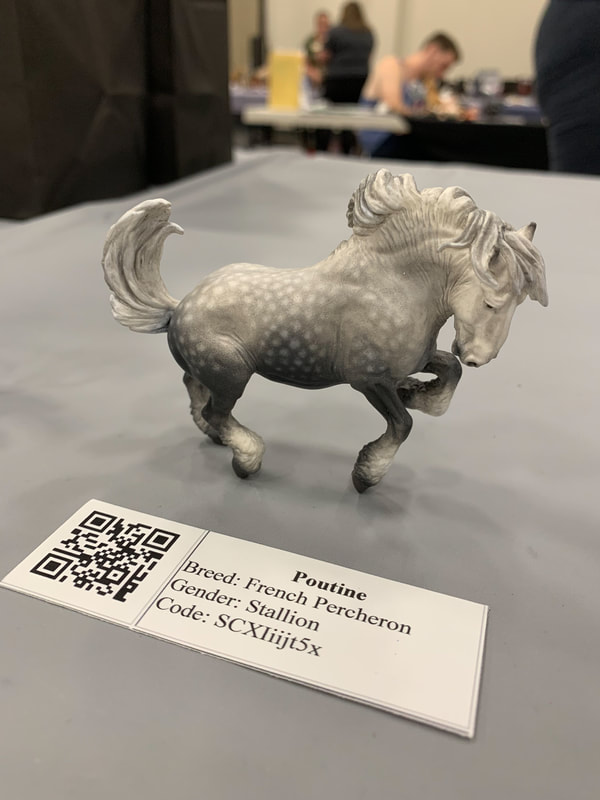 A tiny Sarah Mink mini resin draft horse at The Jennifer Show 2019.